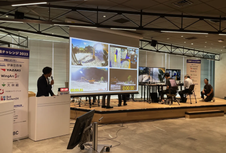 大阪・関西万博で「e建機チャレンジ」開催！万博会場から450km離れた千葉の建機を遠隔操作でタイムトライアル。 | デジコン