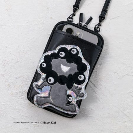 「黒ミャクミャク」スマホポシェット本日発売！　ガバっと開いて必需品も持ち歩ける2層構造 - トラベル Watch
